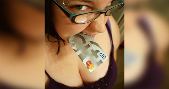 Girl biting credit card