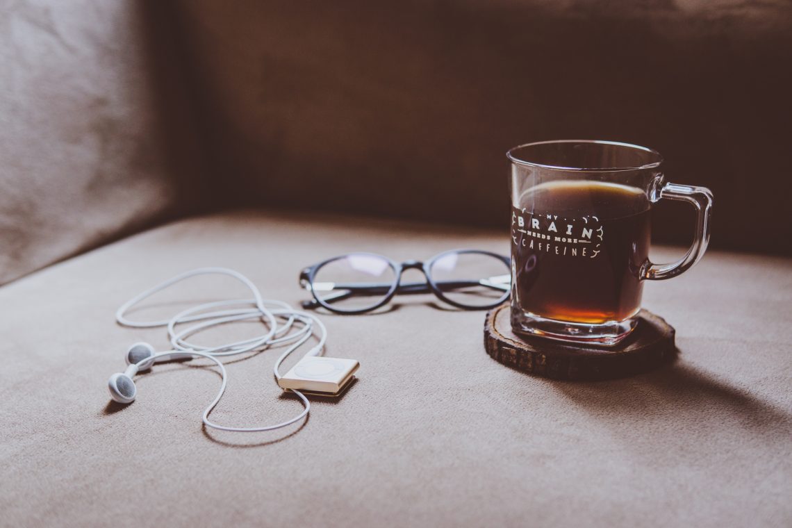 iPod shuffle, headphones and coffee cup